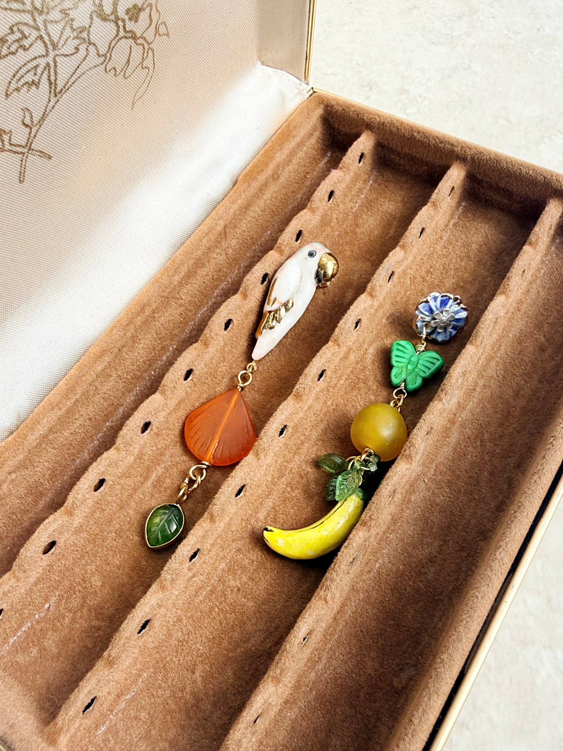 Mismatched bird and fruit earrings