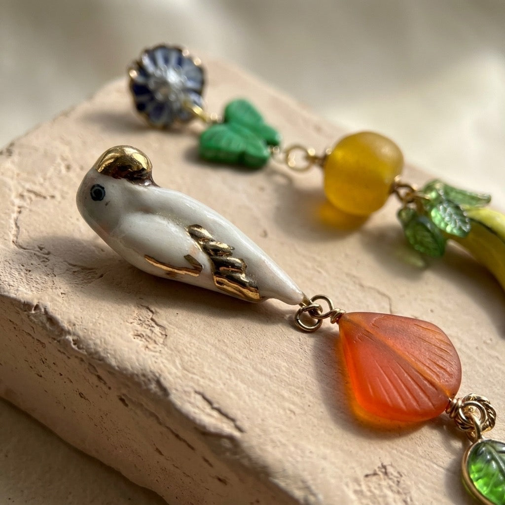 Mismatched bird and fruit earrings